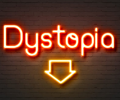 Dystopia neon sign on brick wall background.